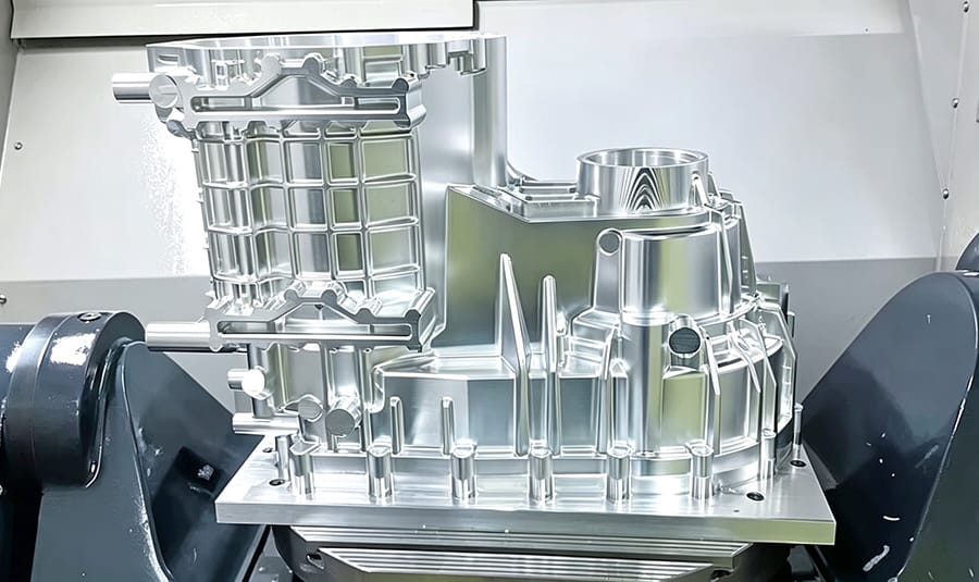 5-axis CNC machine cutting complex aerospace component