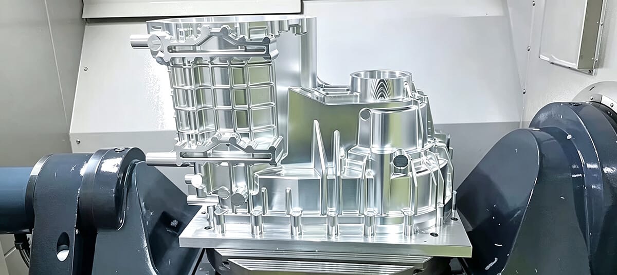 5-axis CNC machine cutting complex aerospace component