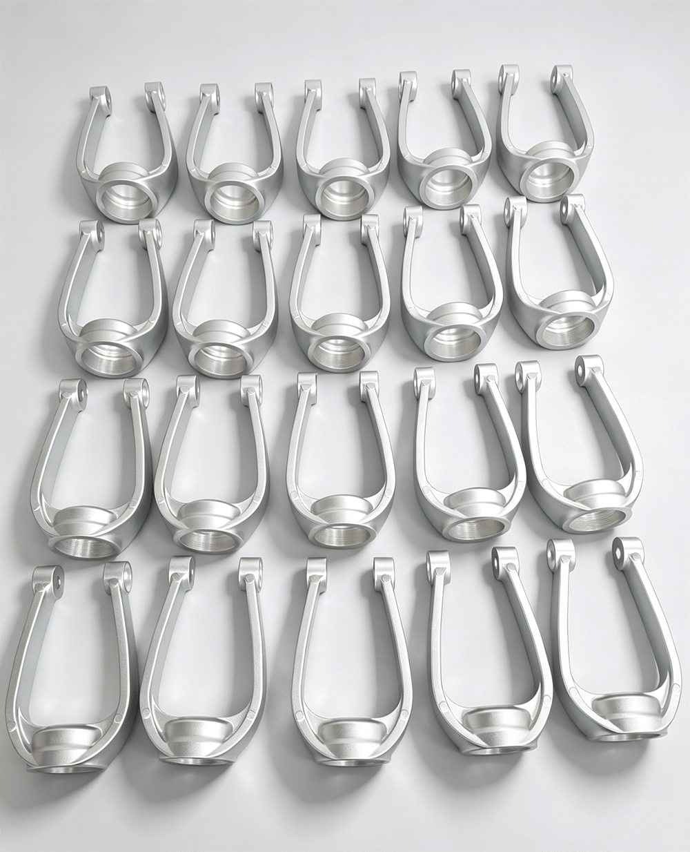 A batch of identical machined aluminum brackets
