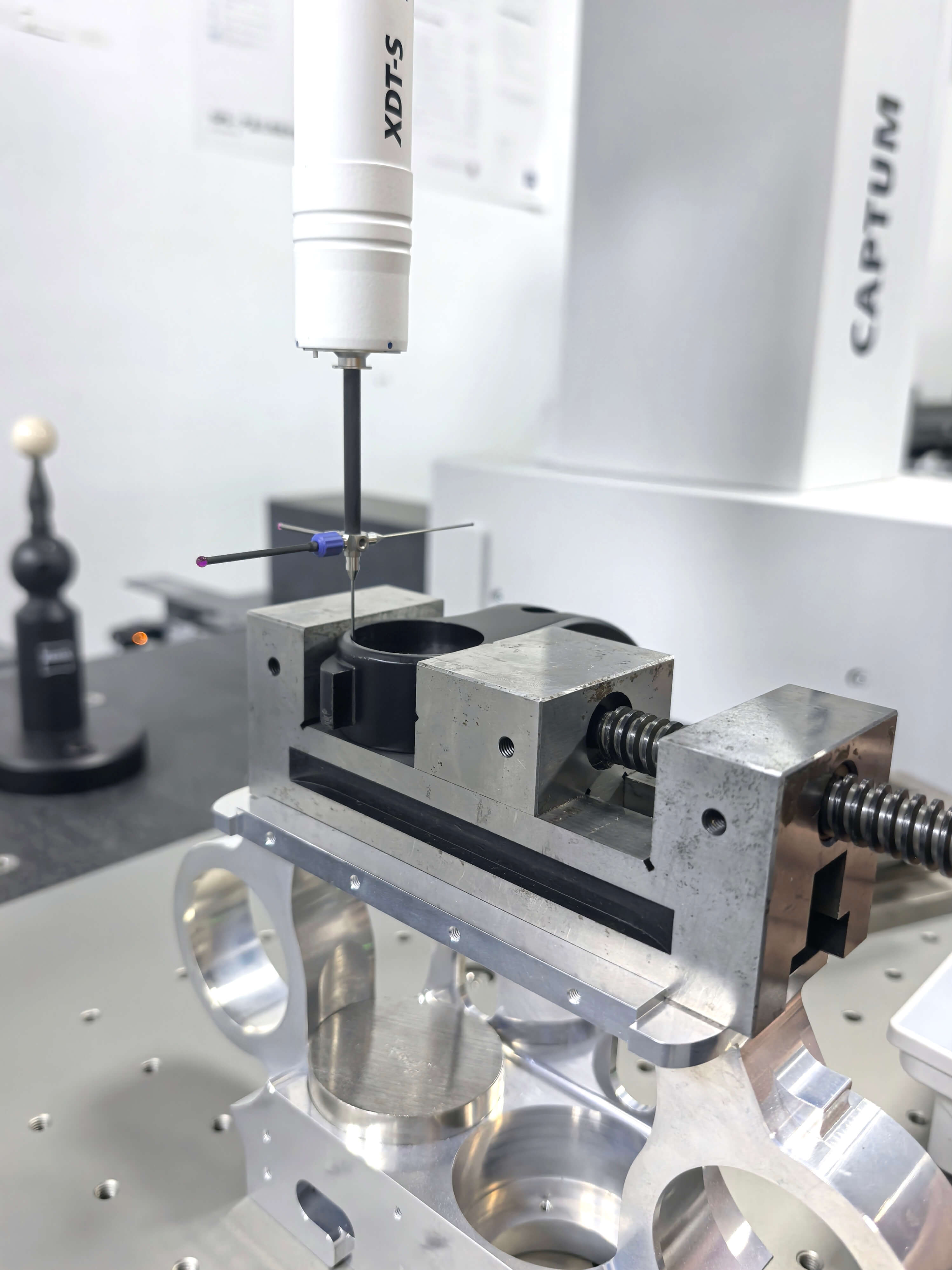 ZEISS coordinate measuring machine inspecting a precision CNC machined component